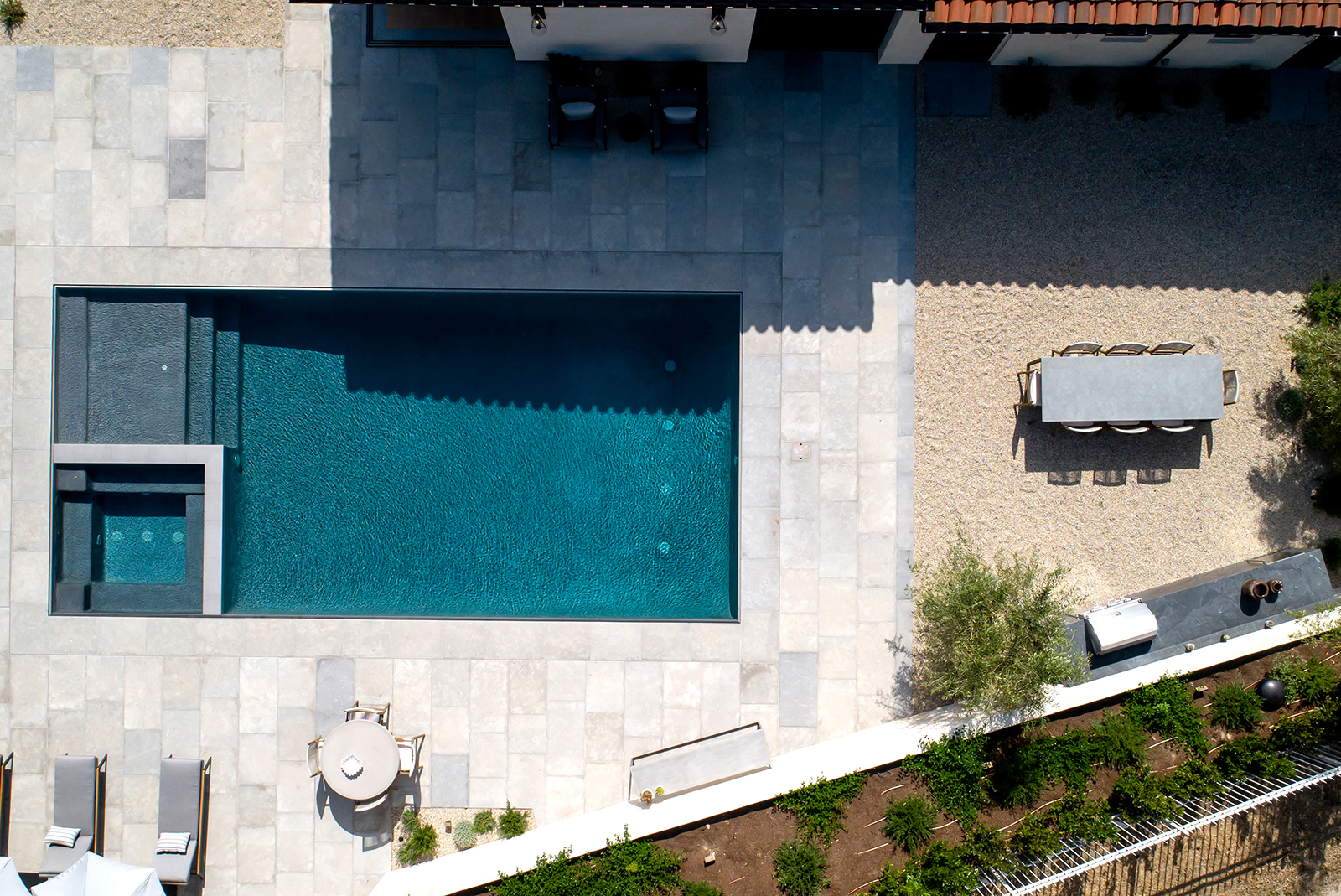 An aerial view of a property with a swimming pool